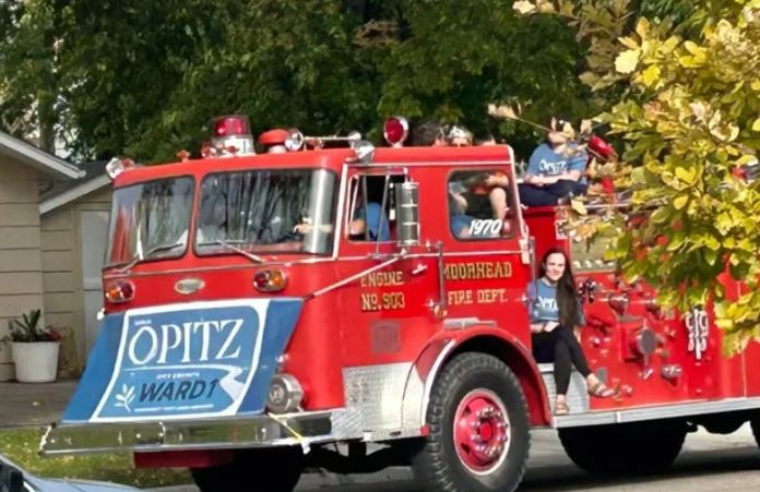 Moorhead City Council candidate Sarah Opitz’s use of fire truck during parade goes to a hearing — KFGO